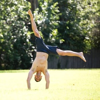 Ryan Hurst doing a cartwheel outside