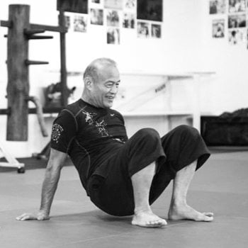 Guro Dan Inosanto performing a squat technique