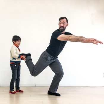 Ryan’s son helping him to be more flexible with a single leg forward lean