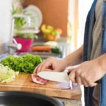 Preparing a healthy meal of meat and vegetables