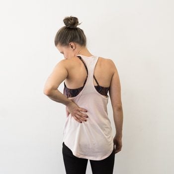 Alicia pointing to areas common for back pain