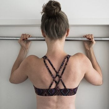 Alicia performing a pull-up for back strength