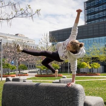 Alicia jumping over rock