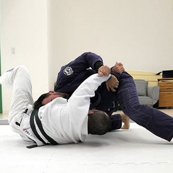 athletes grappling in Brazilian Jiu Jitsu