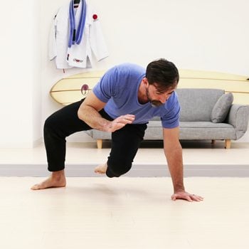 Ryan performing a peacock squat