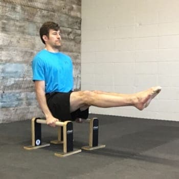 Jeff doing L-sit exercise on parallettes