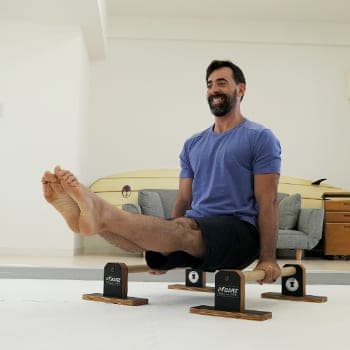 Ryan doing L-sit exercise on Parallettes