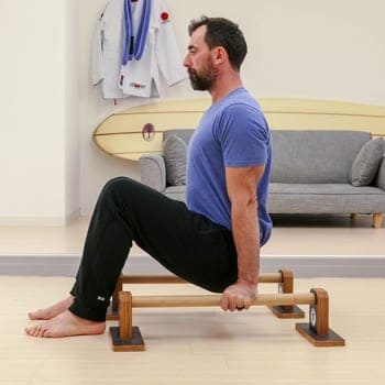 Ryan doing L-sit tuck on parallettes