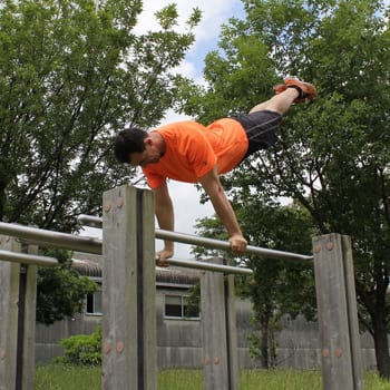 Ryan swinging around on pbars