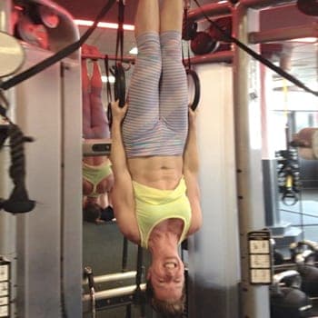 Fi Silk doing inverted ring hang exercise