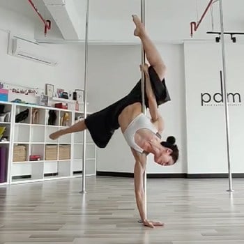 Michelle Ho practicing pole dancing