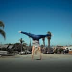 woman doing a handstand on the street in san diego