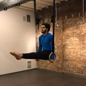Man performing an L-Sit on gymnastic rings