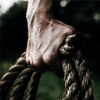 Man gripping rope