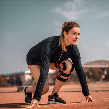 Exercise for Osteoarthritis: Why Movement Heals, Not Hurts 6 Woman running with knee brace